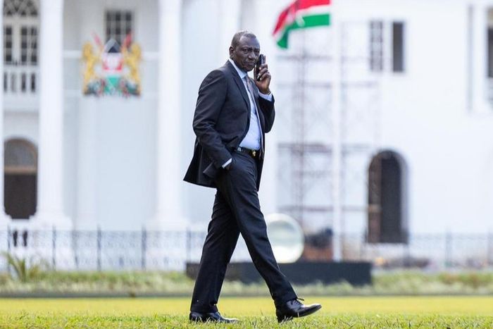 President William Ruto taking a phone call at State House, Nairobi