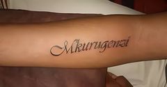 Fan tattoos Abel Mutua's nickname Mkurugenzi on their arm