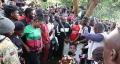 Morners at Brian Chira's funeral