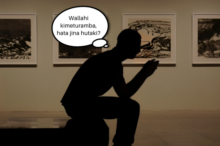 Silhouette of a man thinking hard.