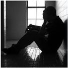 An image depicting a heartbroken man