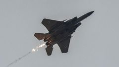 An Israeli air force fighter aircraft releases flares as it flies over along the border with the Gaza Strip near southern Israel on November 12, 2023.Photo by MENAHEM KAHANA/AFP via Getty Images