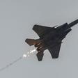 An Israeli air force fighter aircraft releases flares as it flies over along the border with the Gaza Strip near southern Israel on November 12, 2023.Photo by MENAHEM KAHANA/AFP via Getty Images