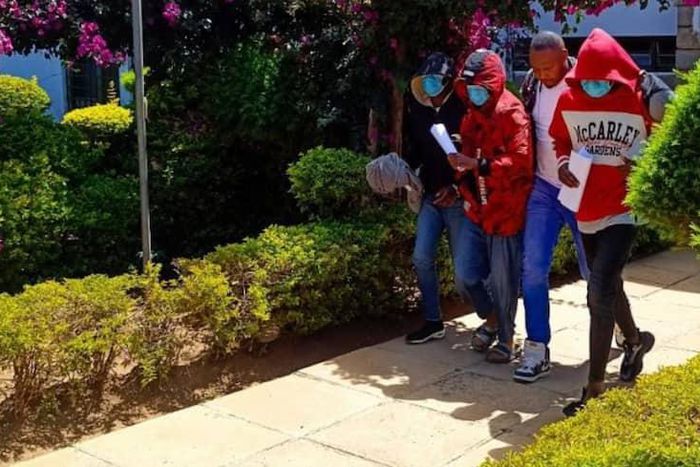 Acquitted suspects in the killing of fashion designer Edwin Chiloba being led out of court