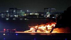 This photo provided by Jiji Press shows a Japan Airlines plane on fire on a runway of Tokyo's Haneda Airport on January 2, 2024.STR/JIJI PRESS/AFP via Getty Images