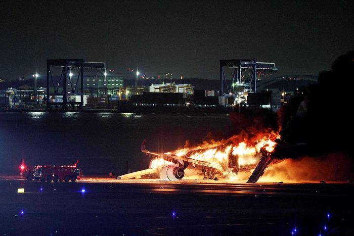This photo provided by Jiji Press shows a Japan Airlines plane on fire on a runway of Tokyo's Haneda Airport on January 2, 2024.STR/JIJI PRESS/AFP via Getty Images