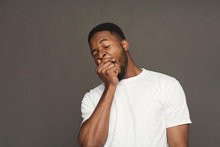 A man yawning