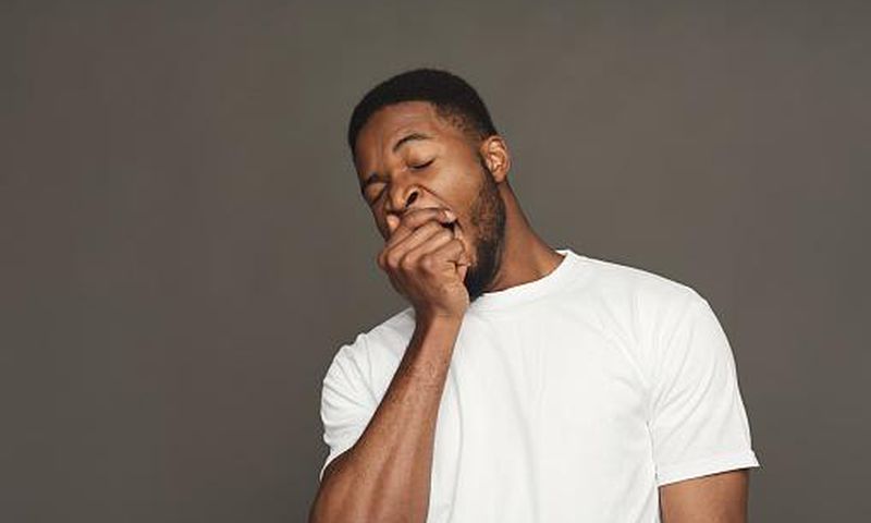 A man yawning