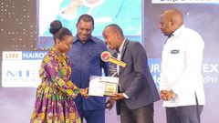 Elizabeth Ochieng' receives her Journalist of the Year award on May 3, 2024