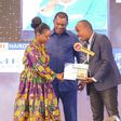 Elizabeth Ochieng' receives her Journalist of the Year award on May 3, 2024