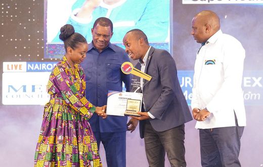 Elizabeth Ochieng' receives her Journalist of the Year award on May 3, 2024