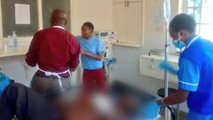 A photo shared by DR. Boni Khalwale saving the life of a man who had been hacked by his son [Twitter]