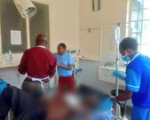 A photo shared by DR. Boni Khalwale saving the life of a man who had been hacked by his son [Twitter]