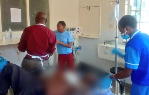 A photo shared by DR. Boni Khalwale saving the life of a man who had been hacked by his son [Twitter]