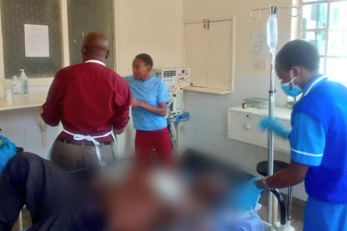 A photo shared by DR. Boni Khalwale saving the life of a man who had been hacked by his son [Twitter]