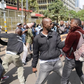 An undercover police officer arrests an activist within the Nairobi's Central Business District (CBD) during a demonstration against the Financial Bill 2023. Photo by John Ochieng