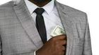 Black man hiding cash [Freepik]