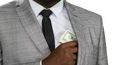 Black man hiding cash [Freepik]