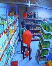 A screengrab of the CCTV footage showing the man and the woman in the supermarket