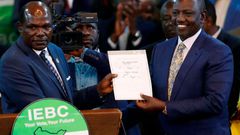 President-elect William Ruto with then IEBC chairman Wafula Chebukati after he was declared the winner of Kenya's presidential election at the IEBC National Tallying Centre at the Bomas of Kenya, in Nairobi, Kenya August 15, 2022