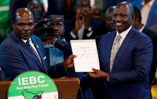 President-elect William Ruto with then IEBC chairman Wafula Chebukati after he was declared the winner of Kenya's presidential election at the IEBC National Tallying Centre at the Bomas of Kenya, in Nairobi, Kenya August 15, 2022