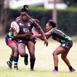 Mwamba's Terry Ayesa (centre) gain grounds from Top Fry Nakuru's Freshia Awino (left) and Yvonne Motari during the Kenya Cup Women's league match played at Impala Club on November 27, 2021. Photo/CHRIS OMOLLO