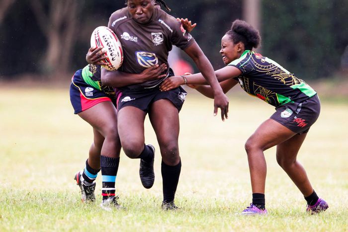 Mwamba's Terry Ayesa (centre) gain grounds from Top Fry Nakuru's Freshia Awino (left) and Yvonne Motari during the Kenya Cup Women's league match played at Impala Club on November 27, 2021. Photo/CHRIS OMOLLO