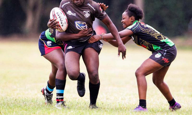Mwamba's Terry Ayesa (centre) gain grounds from Top Fry Nakuru's Freshia Awino (left) and Yvonne Motari during the Kenya Cup Women's league match played at Impala Club on November 27, 2021. Photo/CHRIS OMOLLO