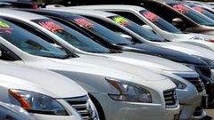 FILE PHOTO: Automobiles are shown for sale at a car dealership in Carlsbad, California