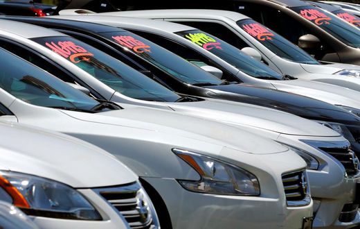 FILE PHOTO: Automobiles are shown for sale at a car dealership in Carlsbad, California