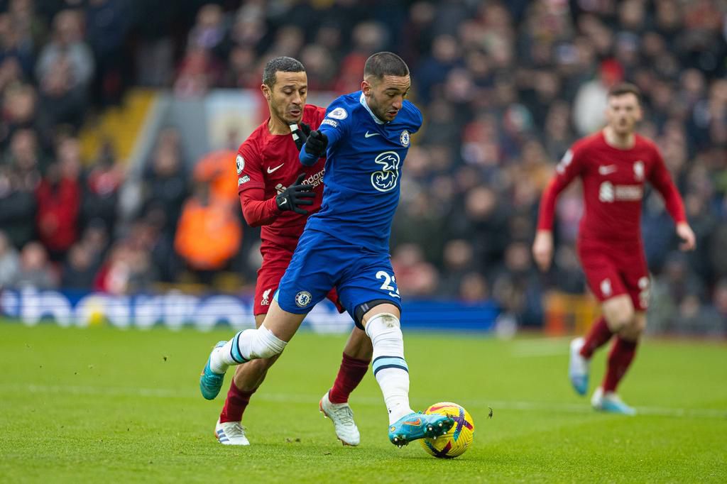 Hakim Ziyech contests with Thiago Alacantara in Chelsea vs Liverpool at Anfield in the Premier League on January 21, 2023.
