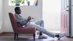 A tall person seated