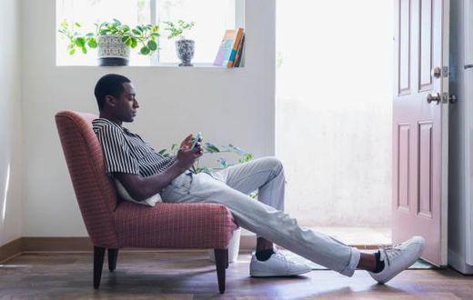 A tall person seated
