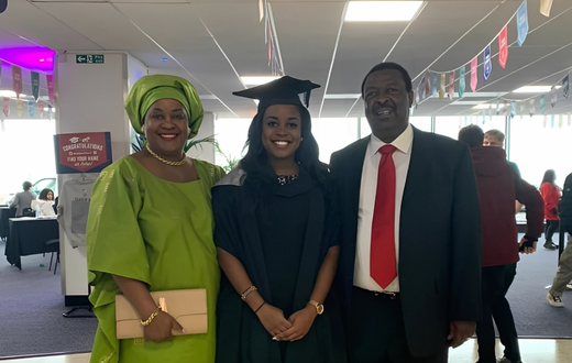 Maryanne Mudavadi with her parents during her graduation