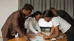 A group of business owners in a meeting [Image Credit: Monstera]