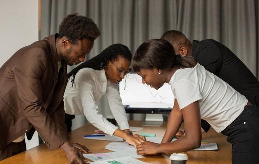 A group of business owners in a meeting [Image Credit: Monstera]