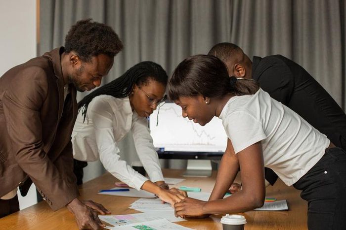 A group of business owners in a meeting [Image Credit: Monstera]