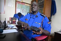 Nairobi Police Commander Adamson Bungei holds up a firearm during a past press briefing