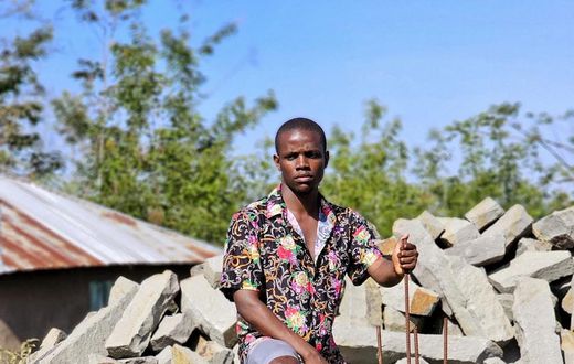 Crazy Kennar constructing church in his village