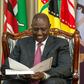 President William Ruto peruses through a document at State House