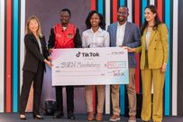 Stacy Wairimu, Chief of Staff & Head of Strategy at BURN Manufacturing (centre) poses with a cheque of $450,000 flanked by Cabinet Secretary Ministry of Youth Affairs, Creative Economy, and Sports Ababu Namwamba & Ara Yoo Han, Global Social Impact Lead at ByteDance / TikTok to the left. On the right is Fortune Sibanda, Public Policy and Government Relations Director, TikTok & Zara Basharat Higgs, Head of Public Policy Program, Pakistan, TikTok.