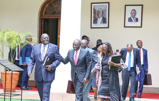President William Ruto shares a light moment with former CS George Magoha
