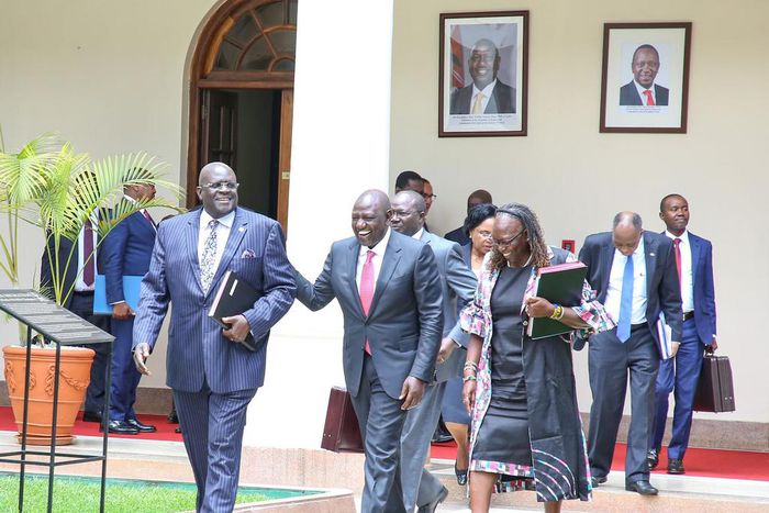 President William Ruto shares a light moment with former CS George Magoha