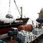 Kenyan port workers load relief food to a Somalia-bound ship at the Kenyan port of Mombasa, October 10 2011 . REUTERS/Joseph Okanga