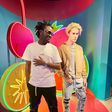 Singer Bahati posing next to the wax statue of pop singer Justin Bieber at Madame Tussauds Museum, Singapore