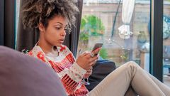 Woman surprised using iPhone