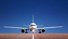 A photo of a plane of a runway