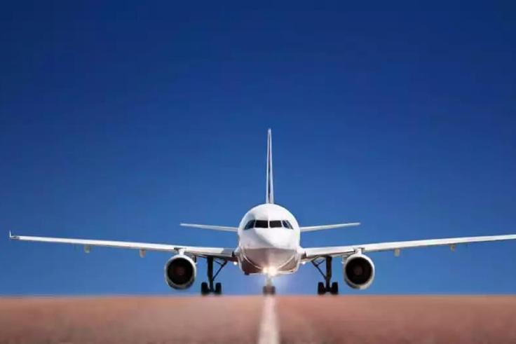 A photo of a plane of a runway