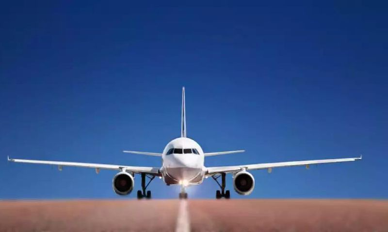 A photo of a plane of a runway