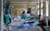 Medical practitioners attend to a cholera patient inside a special ward at the Kenyatta National Hospital in Nairobi, Kenya July 19, 2017.